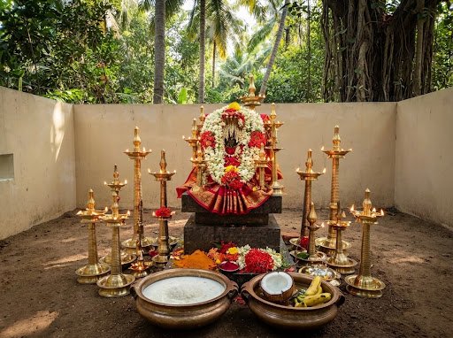 Sacred Naga Yakshi Amma sanctum altar inside the walled enclosure with burning deepams and milk offering