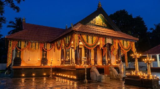 Nedungad Puliyampilly Bhagavathy Temple Sanctum illuminated at dusk with brass oil lamps and traditional marigold floral decorations
